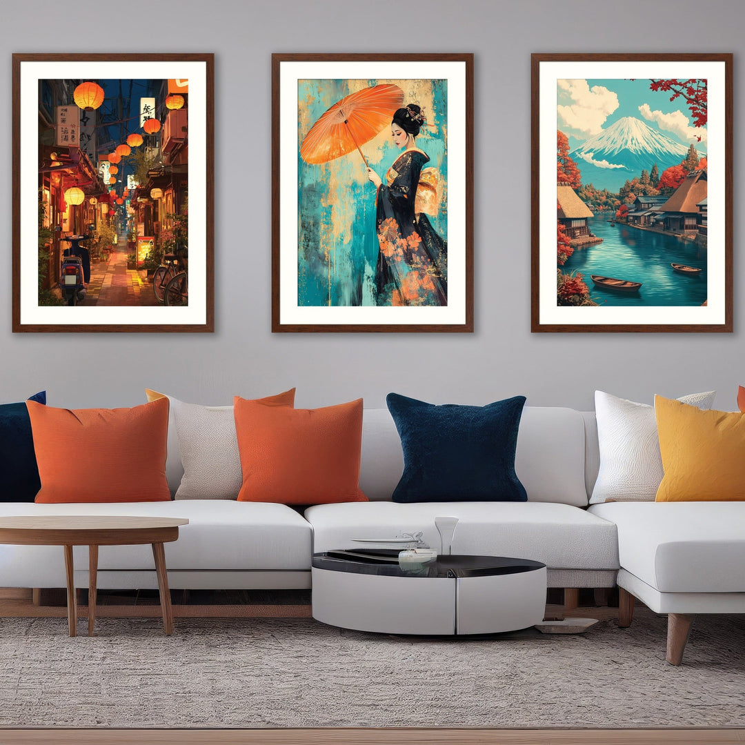 Three walnut-framed Japanese art prints – lantern-lit alley, geisha with orange parasol and Mount Fuji village – above a white sofa