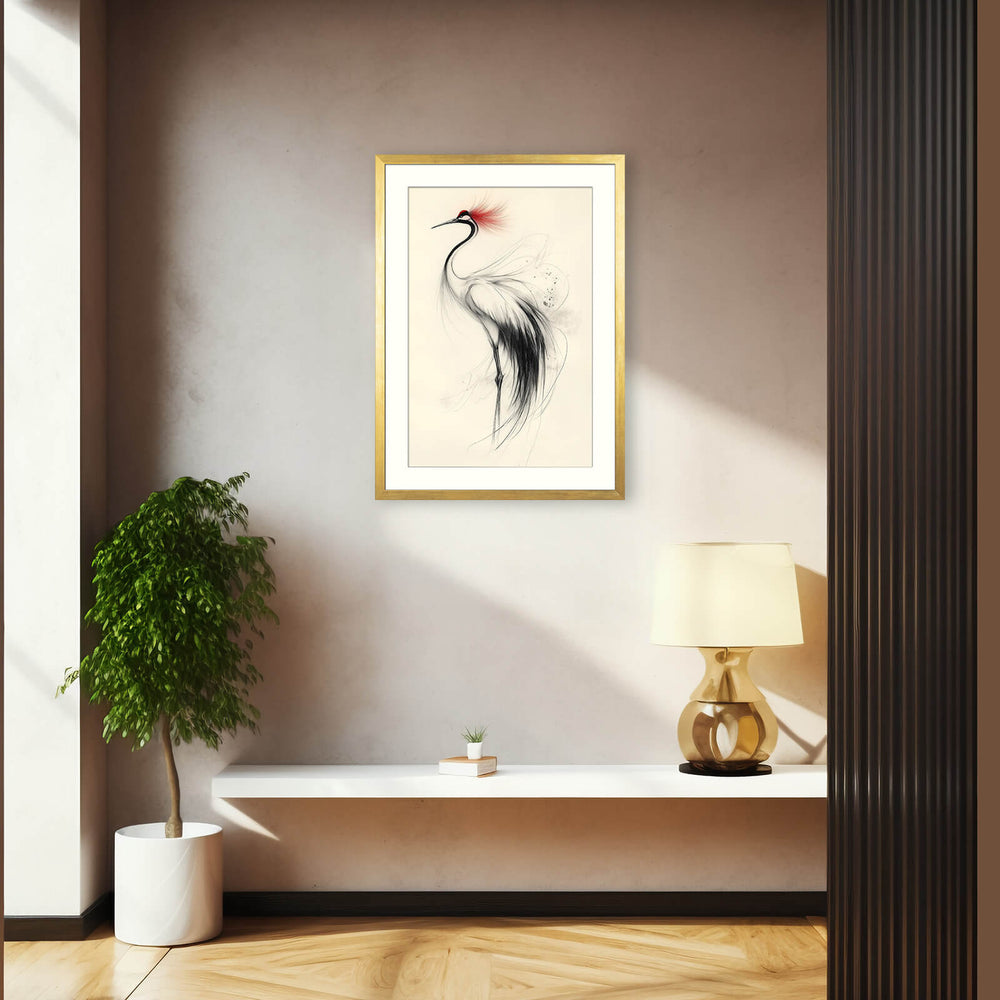 Gold-framed crane ink print on a modern entryway wall above a console