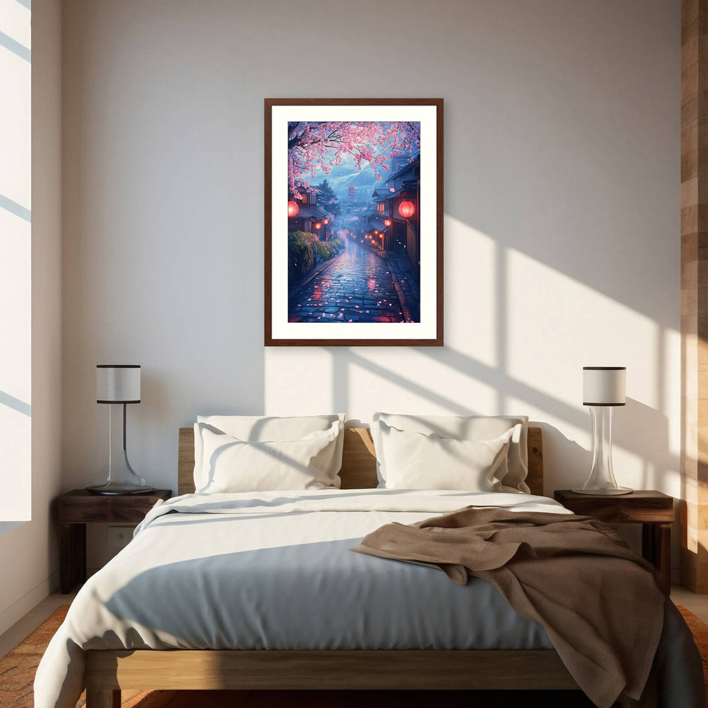 Dark wood framed sakura street print hung above a bed in a bright, sunlit bedroom